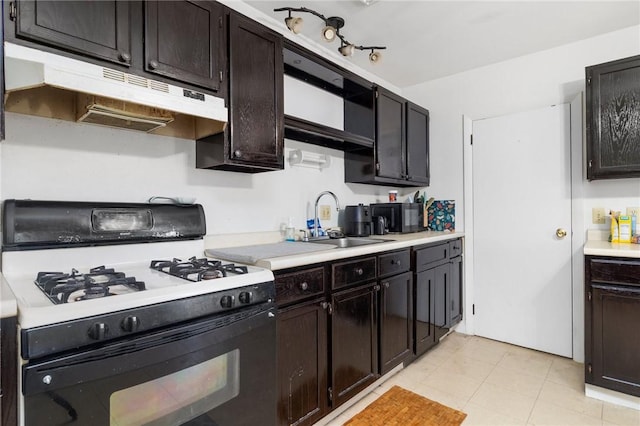 598 Laurel Hill Ave, Cranston, RI 02920 - kitchen with range with gas cooktop, under cabinet range hood, light countertops, and light tile patterned floors