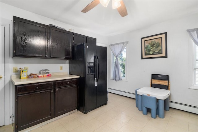 598 Laurel Hill Ave, Cranston, RI 02920 - kitchen with baseboard heating, black fridge with ice dispenser, healthy amount of natural light, and light countertops