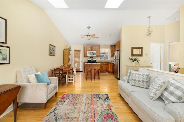 104 Conanicus Rd, Narragansett, RI 02882 - living room with a skylight, lofted ceiling, and light wood finished floors