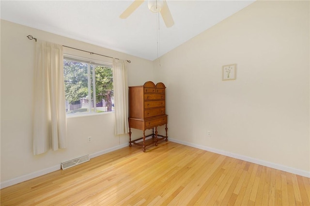 104 Conanicus Rd, Narragansett, RI 02882 - empty room with hardwood / wood-style flooring, lofted ceiling, and ceiling fan