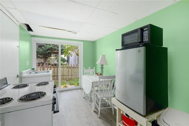 104 Conanicus Rd, Narragansett, RI 02882 - kitchen featuring white appliances and light wood-style floors