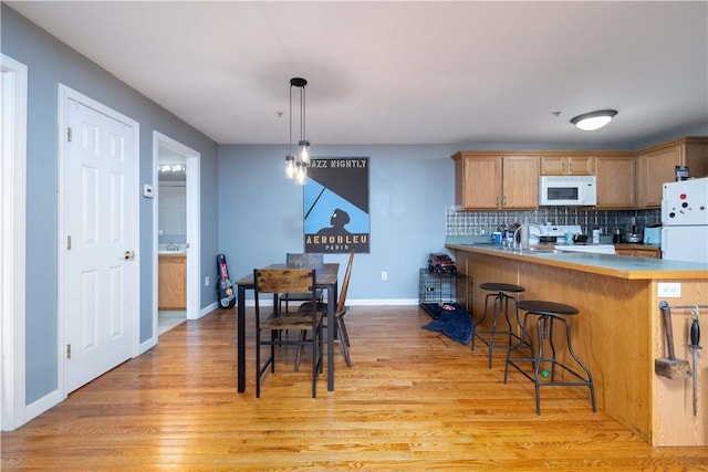 1 Fay St Unit 2, Worcester, MA 01604 - dining area with light wood-style floors and baseboards