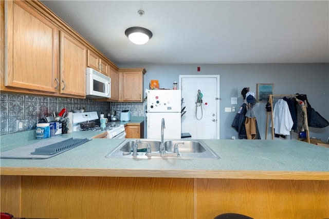 1 Fay St Unit 2, Worcester, MA 01604 - kitchen with white appliances, light countertops, backsplash, and a peninsula