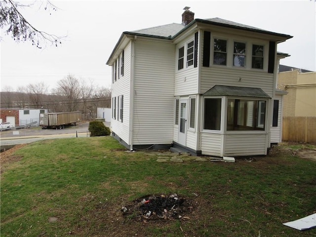 690 Killingly St, Johnston, RI 02919 - rear view of house featuring a chimney and a shingled roof