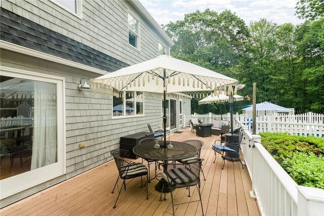 5 Havens Rd, Westerly, RI 02891 - wooden terrace featuring outdoor dining area and a grill