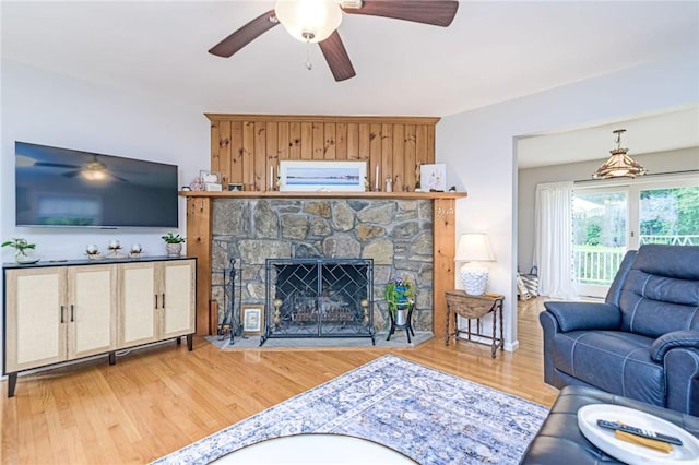 5 Havens Rd, Westerly, RI 02891 - living room with ceiling fan, wood finished floors, and a stone fireplace
