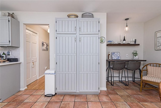 5 Havens Rd, Westerly, RI 02891 - kitchen with light countertops, decorative backsplash, and light tile patterned floors