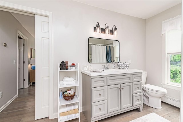 5 Havens Rd, Westerly, RI 02891 - bathroom featuring a baseboard radiator, wood finished floors, vanity, and a shower with shower curtain