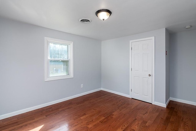 136 Davis Ave, Cranston, RI 02910 - unfurnished bedroom with dark wood-type flooring and baseboards