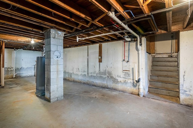 136 Davis Ave, Cranston, RI 02910 - unfinished below grade area featuring water heater and stairs