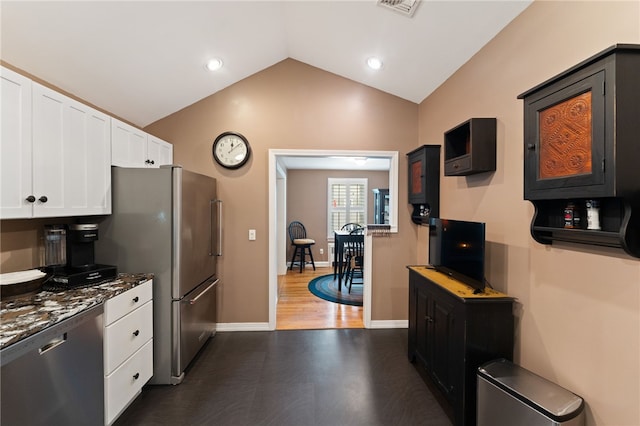 320 Miantonomo Dr, Warwick, RI 02888 - kitchen with appliances with stainless steel finishes, vaulted ceiling, white cabinetry, and recessed lighting