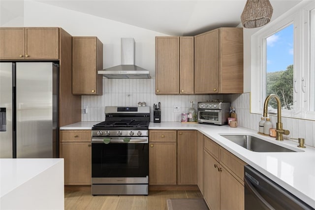 193 Mohawk Trl, Cranston, RI 02921 - kitchen featuring wall chimney range hood, stainless steel appliances, light countertops, backsplash, and lofted ceiling