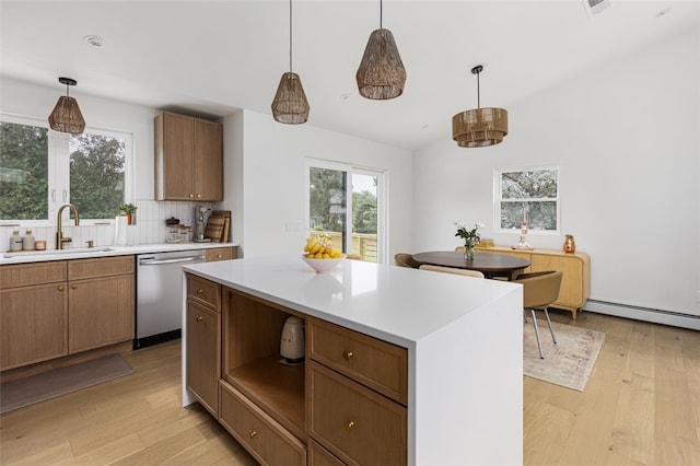 193 Mohawk Trl, Cranston, RI 02921 - kitchen with dishwasher, light wood-type flooring, light countertops, decorative light fixtures, and vaulted ceiling
