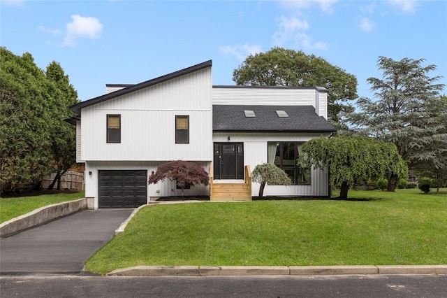 193 Mohawk Trl, Cranston, RI 02921 - view of front of property with an attached garage, a front lawn, and asphalt driveway