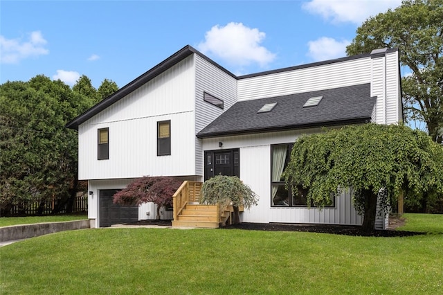 193 Mohawk Trl, Cranston, RI 02921 - rear view of property with a garage, a lawn, driveway, and roof with shingles