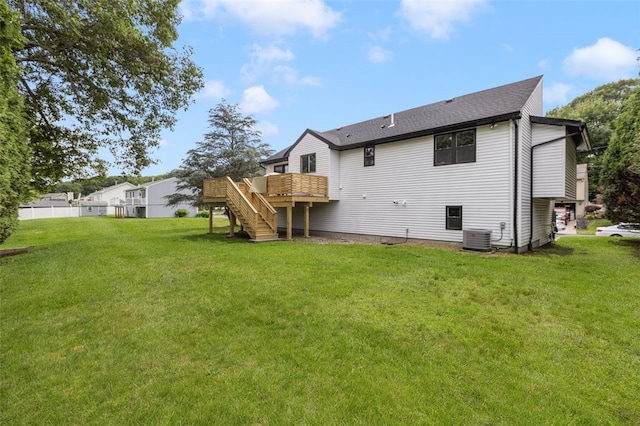 193 Mohawk Trl, Cranston, RI 02921 - back of house featuring stairway, a deck, and a lawn