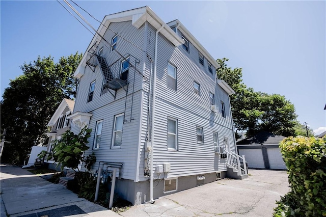 25 Unit St, Providence, RI 02909 - view of property exterior featuring an outbuilding and a detached garage