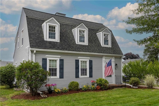 31 Bowen St, East Providence, RI 02916 - colonial inspired home with a front lawn and roof with shingles