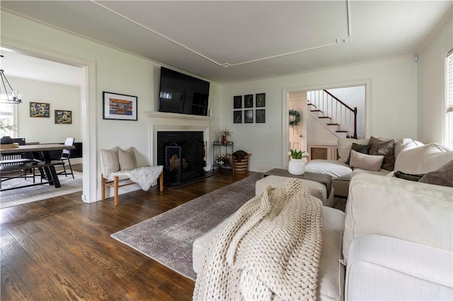 31 Bowen St, East Providence, RI 02916 - living room featuring dark wood-type flooring, a fireplace, and stairway