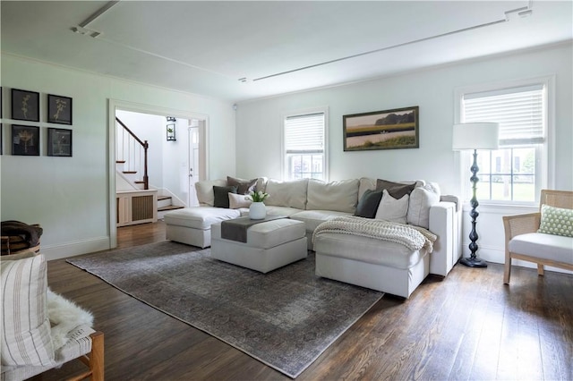 31 Bowen St, East Providence, RI 02916 - living room with dark wood-style flooring, stairs, and radiator heating unit