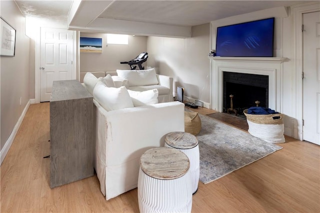 31 Bowen St, East Providence, RI 02916 - living room featuring wood finished floors and a fireplace with flush hearth