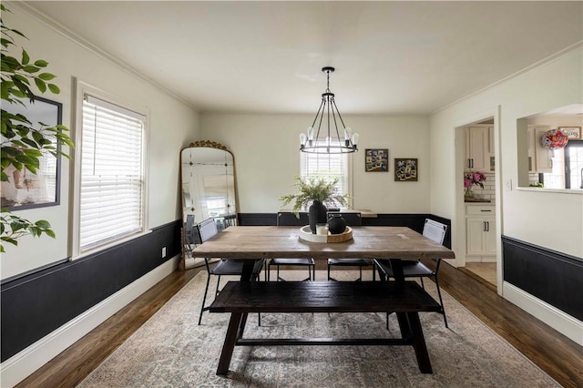 31 Bowen St, East Providence, RI 02916 - dining area featuring wood finished floors, a chandelier, and ornamental molding