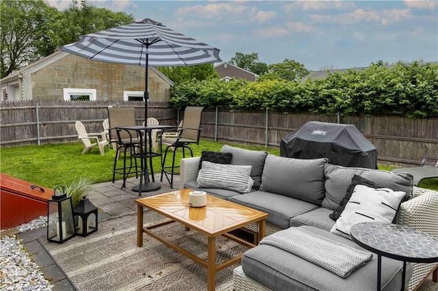 31 Bowen St, East Providence, RI 02916 - fenced backyard with an outdoor living space, a grill, and a patio area