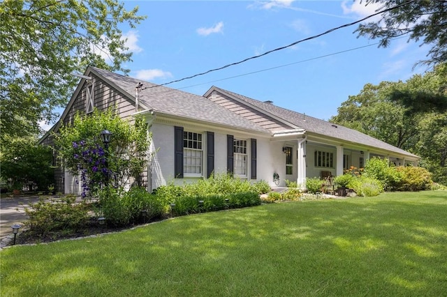469 Fletcher Rd, North Kingstown, RI 02852 - single story home with a front lawn, roof with shingles, and stucco siding