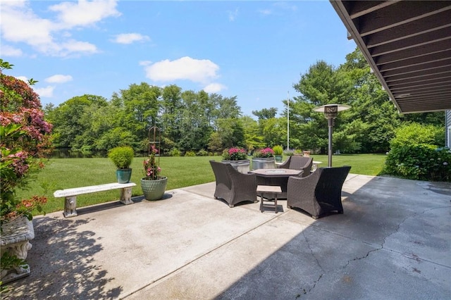 469 Fletcher Rd, North Kingstown, RI 02852 - view of patio / terrace featuring outdoor dining area and view of wooded area