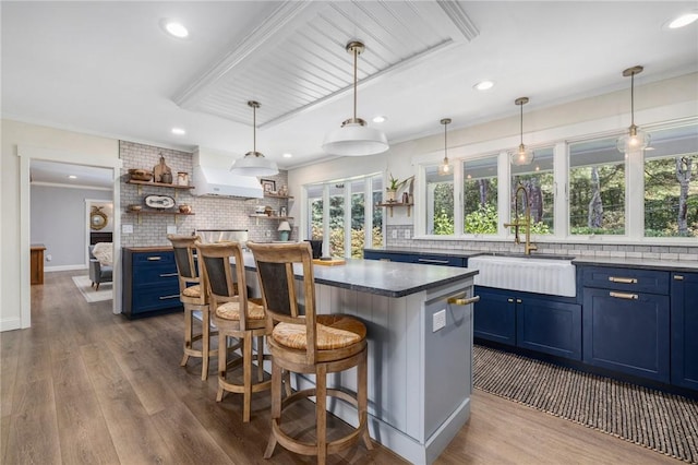 469 Fletcher Rd, North Kingstown, RI 02852 - kitchen with blue cabinetry, open shelves, backsplash, recessed lighting, and crown molding