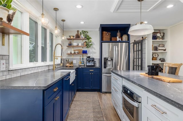469 Fletcher Rd, North Kingstown, RI 02852 - kitchen with stainless steel appliances, open shelves, blue cabinetry, light wood-style flooring, and backsplash