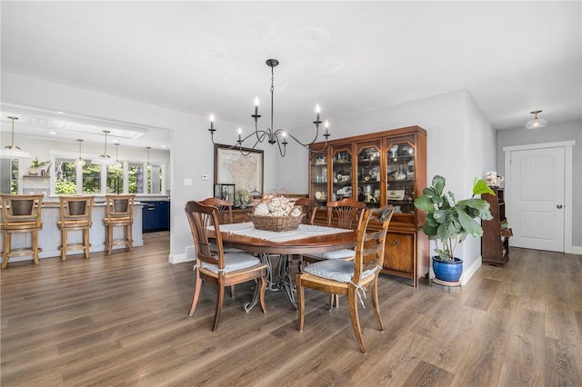 469 Fletcher Rd, North Kingstown, RI 02852 - dining area with a chandelier and wood finished floors