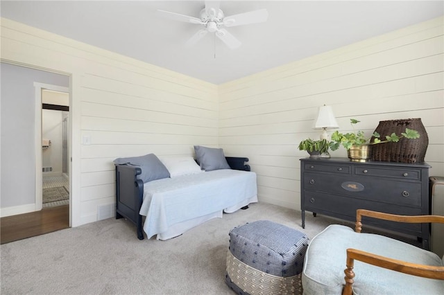 469 Fletcher Rd, North Kingstown, RI 02852 - bedroom with carpet flooring, wooden walls, and ceiling fan