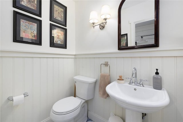 469 Fletcher Rd, North Kingstown, RI 02852 - bathroom with a decorative wall and a wainscoted wall