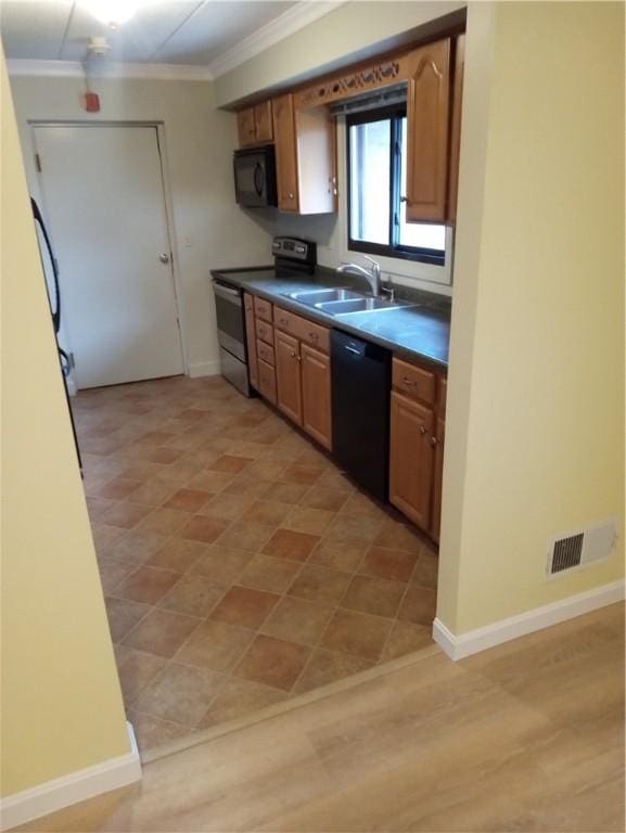 510 Child St Unit 106C, Warren, RI 02885 - kitchen with black appliances, ornamental molding, dark countertops, and brown cabinetry