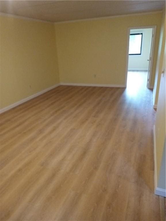 510 Child St Unit 106C, Warren, RI 02885 - empty room with light wood-style floors and ornamental molding