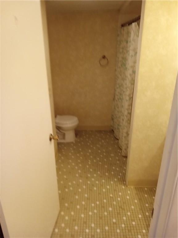 510 Child St Unit 106C, Warren, RI 02885 - bathroom with toilet and tile patterned flooring