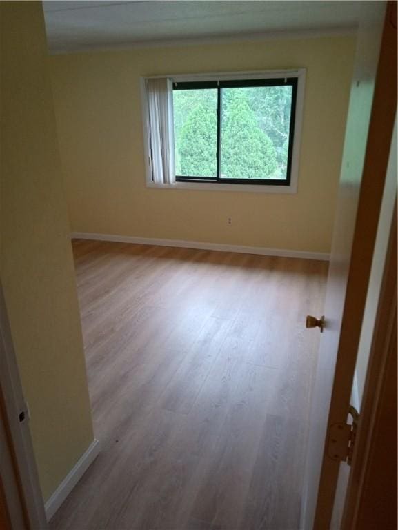 510 Child St Unit 106C, Warren, RI 02885 - spare room with wood finished floors and baseboards