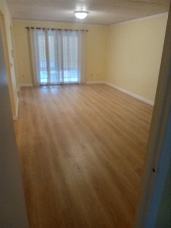 510 Child St Unit 106C, Warren, RI 02885 - empty room with light wood finished floors and baseboards