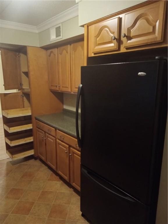 510 Child St Unit 106C, Warren, RI 02885 - kitchen with freestanding refrigerator, crown molding, and dark countertops