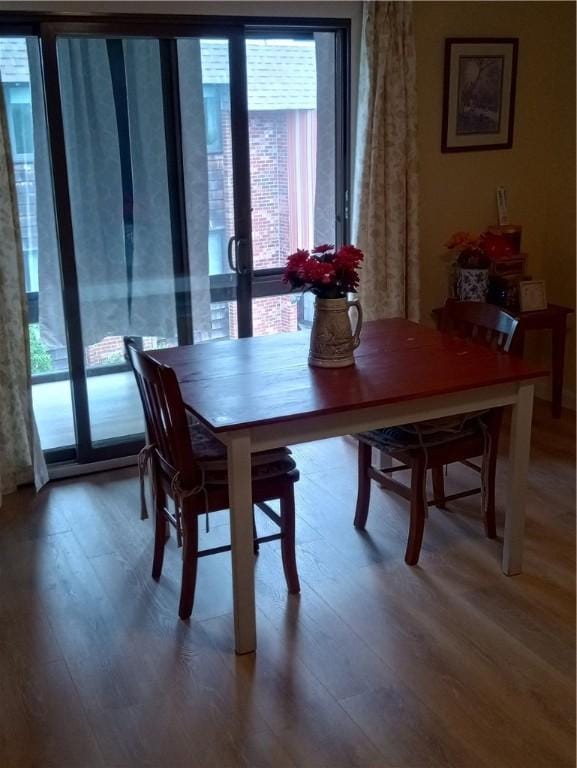510 Child St Unit 106C, Warren, RI 02885 - dining area featuring healthy amount of natural light and wood finished floors