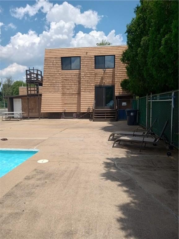 510 Child St Unit 106C, Warren, RI 02885 - back of house featuring a patio area and mansard roof