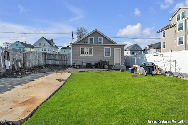 222 Pavilion Ave, Providence, RI 02905 - rear view of house with a fenced backyard and a residential view