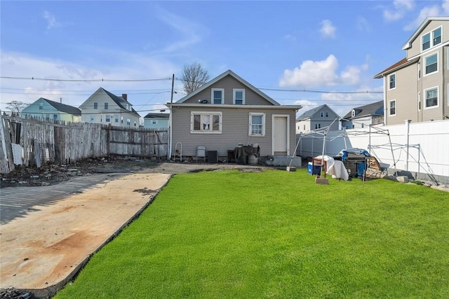 222 Pavilion Ave, Providence, RI 02905 - rear view of property featuring a fenced backyard and a residential view