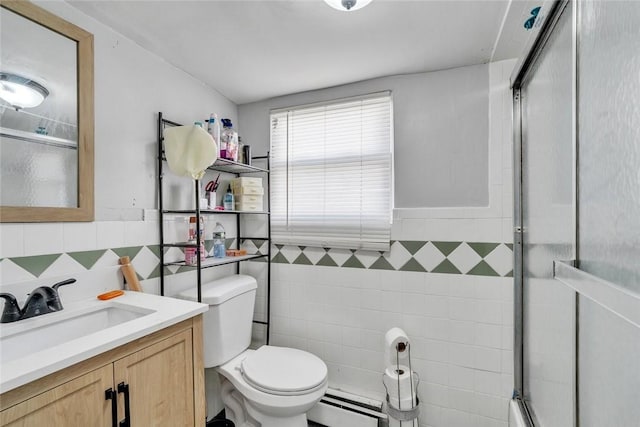 222 Pavilion Ave, Providence, RI 02905 - bathroom featuring tile walls, baseboard heating, an enclosed shower, vanity, and a wainscoted wall