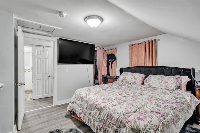 222 Pavilion Ave, Providence, RI 02905 - bedroom featuring wood finished floors, lofted ceiling, and attic access