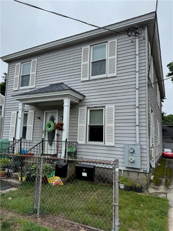 54 Arthur St, West Warwick, RI 02893 - view of front facade featuring a fenced front yard