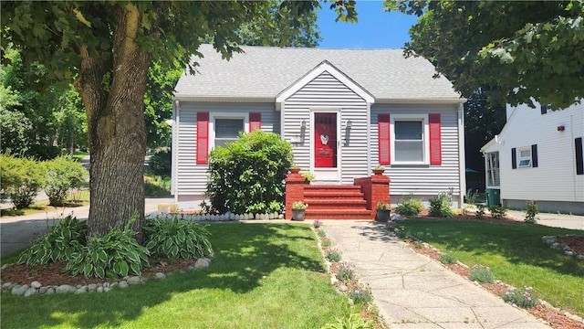 788 Cass Ave, Woonsocket, RI 02895 - view of front facade with a front lawn and roof with shingles