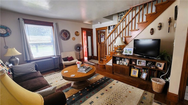 788 Cass Ave, Woonsocket, RI 02895 - living room featuring radiator heating unit, wood finished floors, and stairs