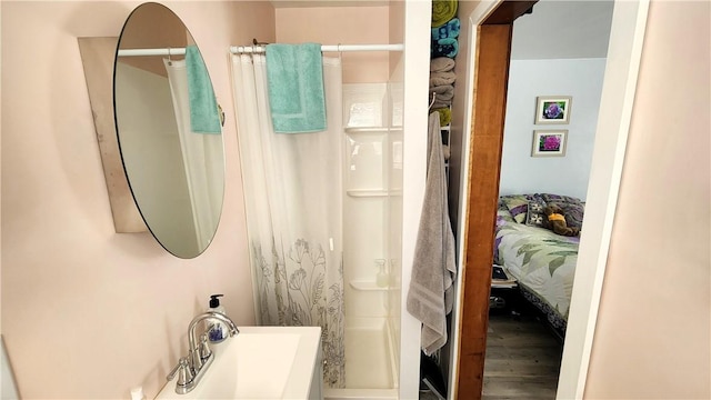788 Cass Ave, Woonsocket, RI 02895 - full bath featuring curtained shower, wood finished floors, and ensuite bath